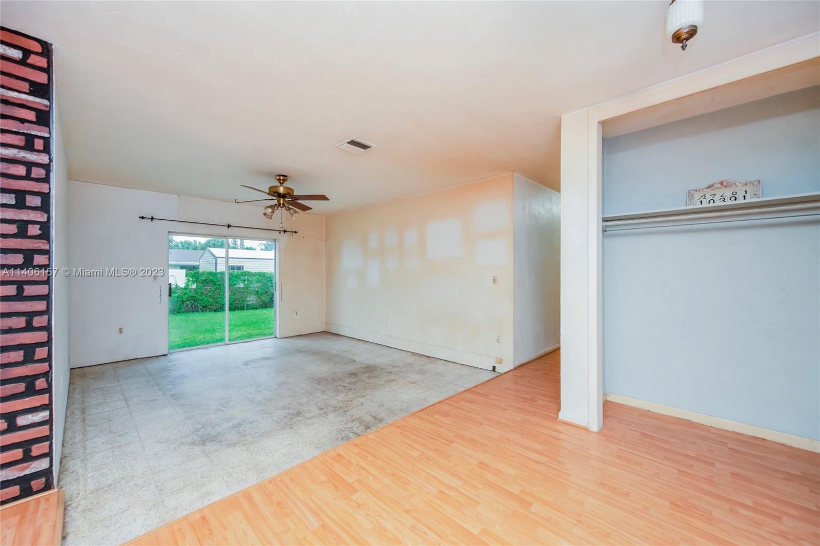 10391 Southwest 156th Street Miami, FL 33157 - Photo 12 of 33 a view of a big room with a windows and a ceiling fan