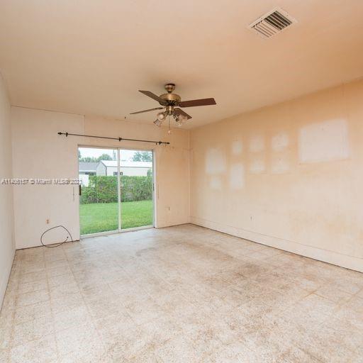 10391 Southwest 156th Street Miami, FL 33157 - Photo 15 of 33 a view of an empty room with a window