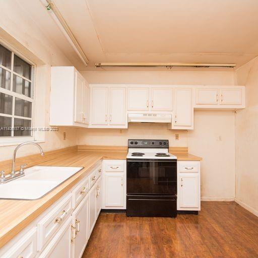 10391 Southwest 156th Street Miami, FL 33157 - Photo 20 of 33 a kitchen with stainless steel appliances granite countertop a sink and a stove