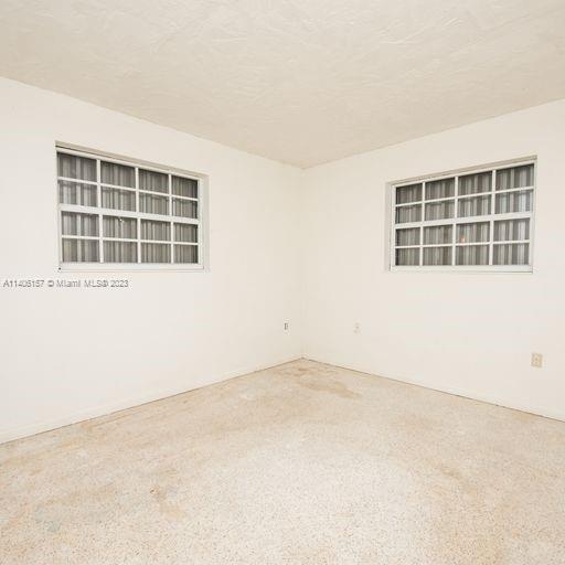 10391 Southwest 156th Street Miami, FL 33157 - Photo 23 of 33 an empty room with a window