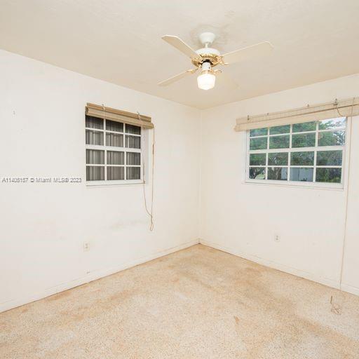 10391 Southwest 156th Street Miami, FL 33157 - Photo 27 of 33 an empty room with windows