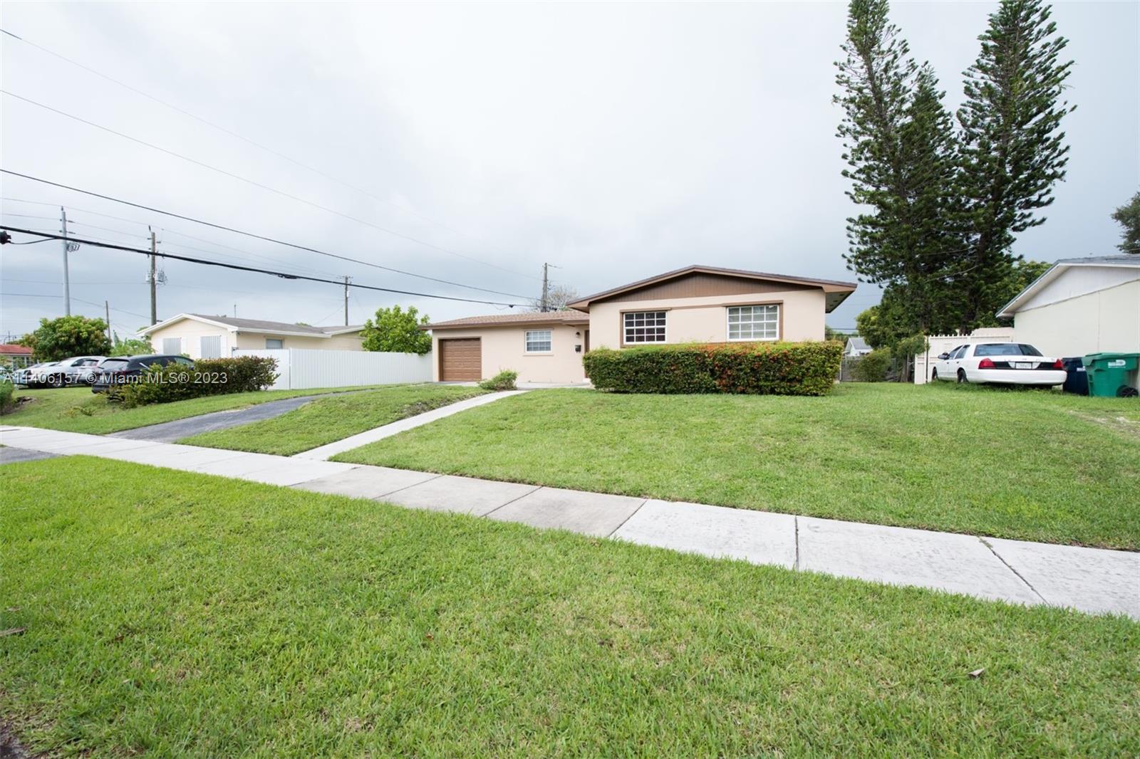 10391 Southwest 156th Street Miami, FL 33157 - Photo 5 of 33 a view of a house with a back yard