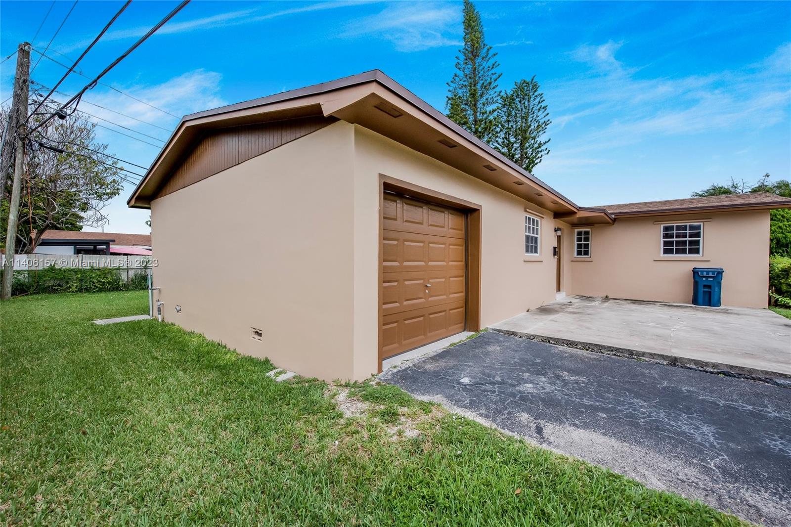 10391 Southwest 156th Street Miami, FL 33157 - Photo 6 of 33 a house with a yard