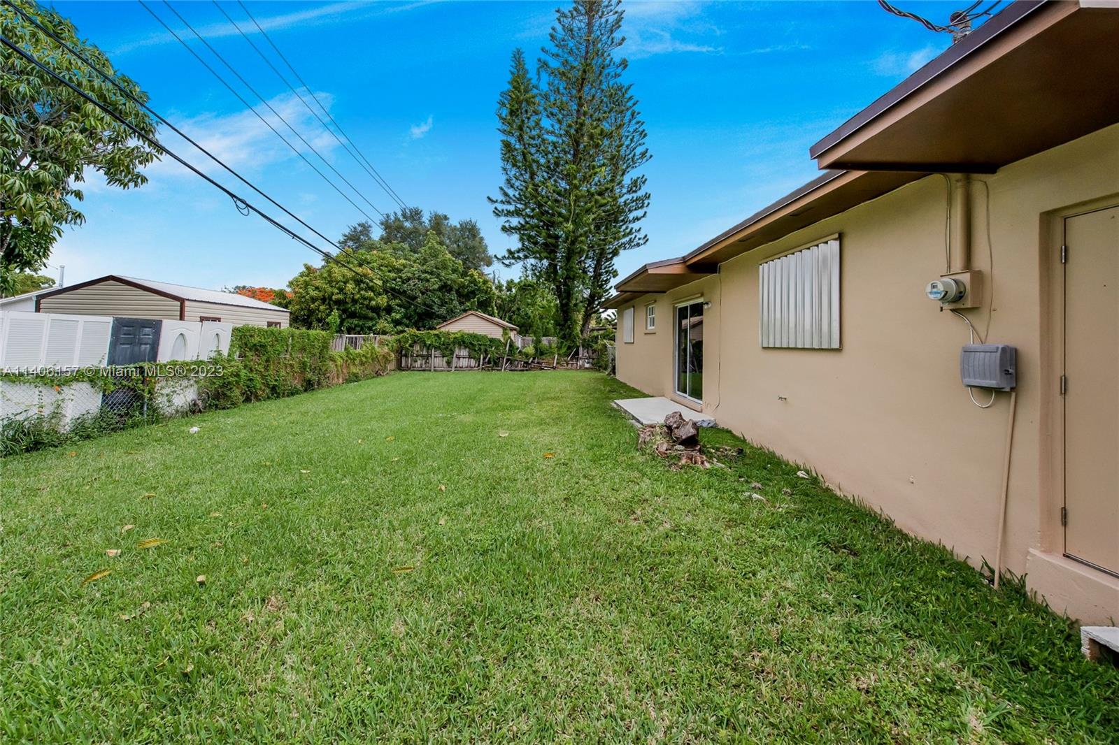 10391 Southwest 156th Street Miami, FL 33157 - Photo 7 of 33 a view of a back yard of the house