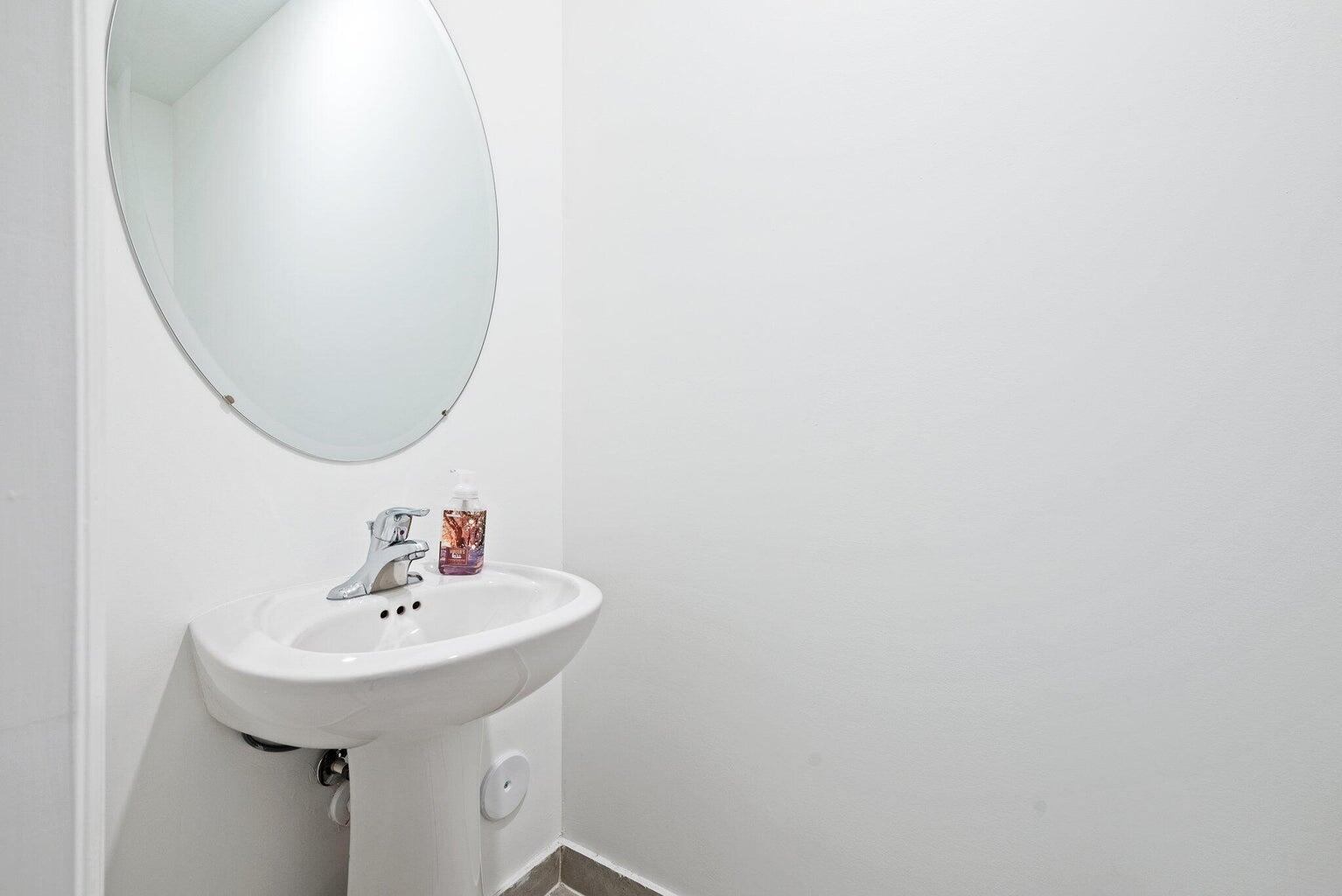 2701 Southeast 10th Street Homestead, FL 33035 - Photo 12 of 23 a bathroom with a sink and a mirror