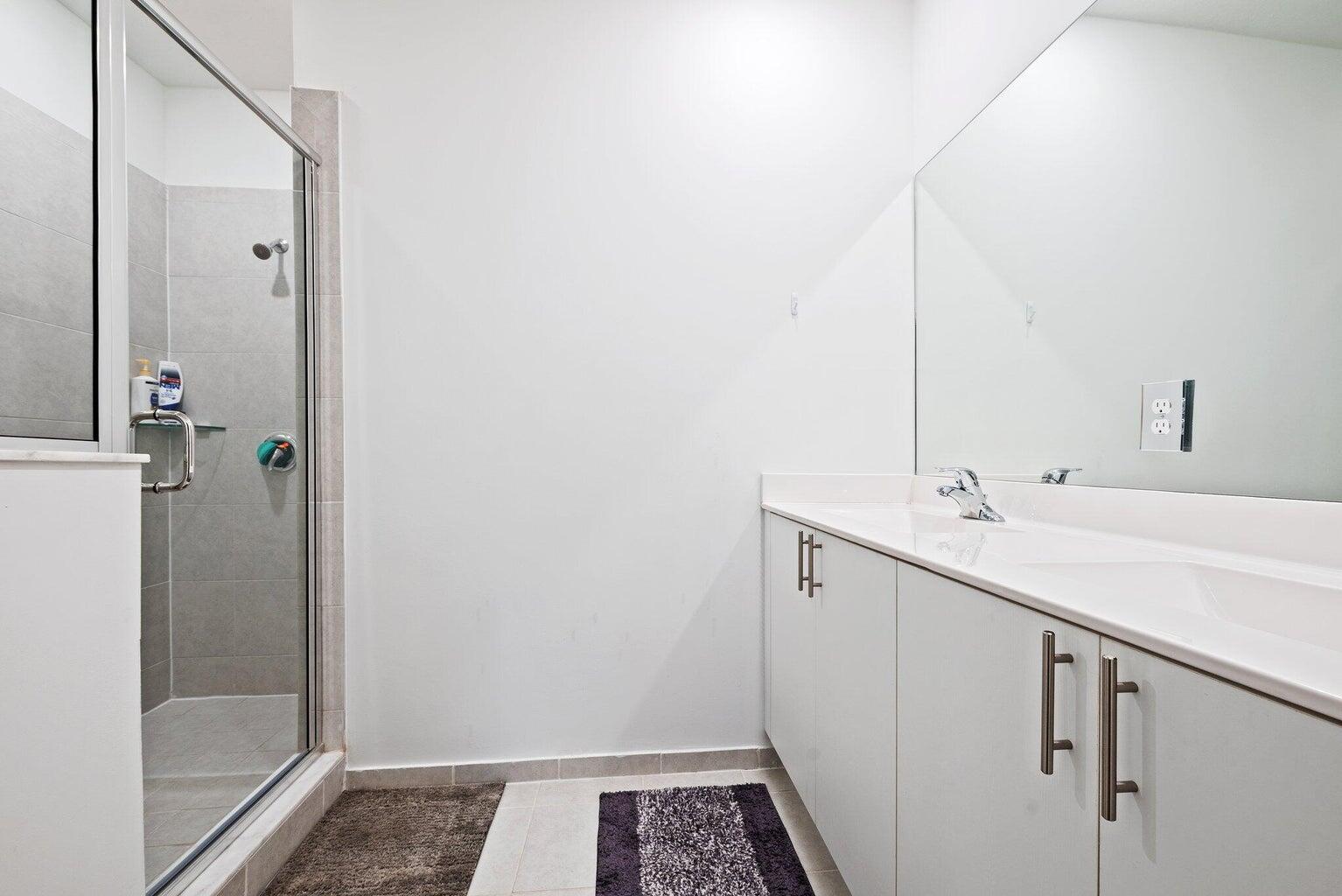 2701 Southeast 10th Street Homestead, FL 33035 - Photo 16 of 23 a bathroom with a sink and a mirror