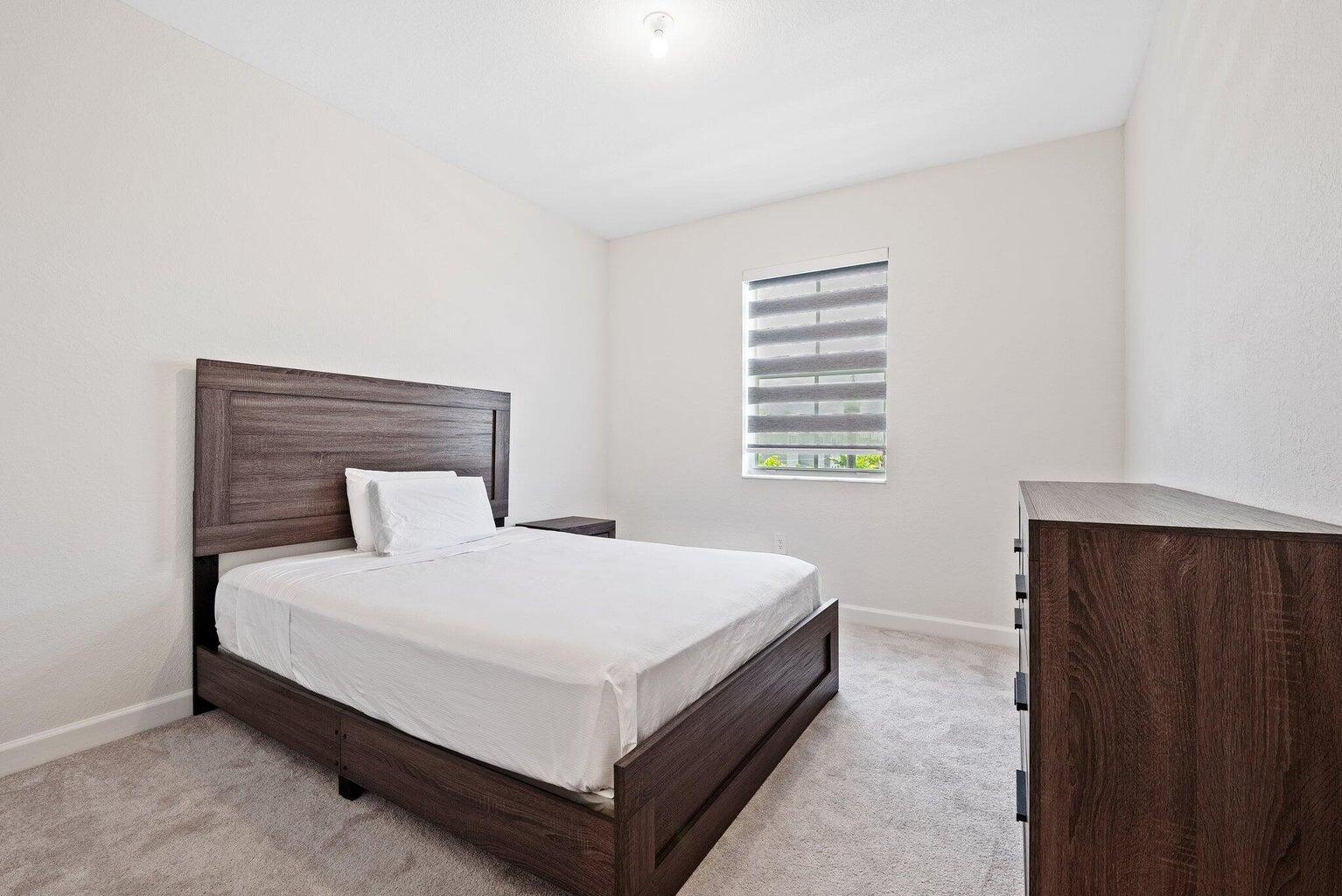 2701 Southeast 10th Street Homestead, FL 33035 - Photo 20 of 23 a bedroom with a bed and a window