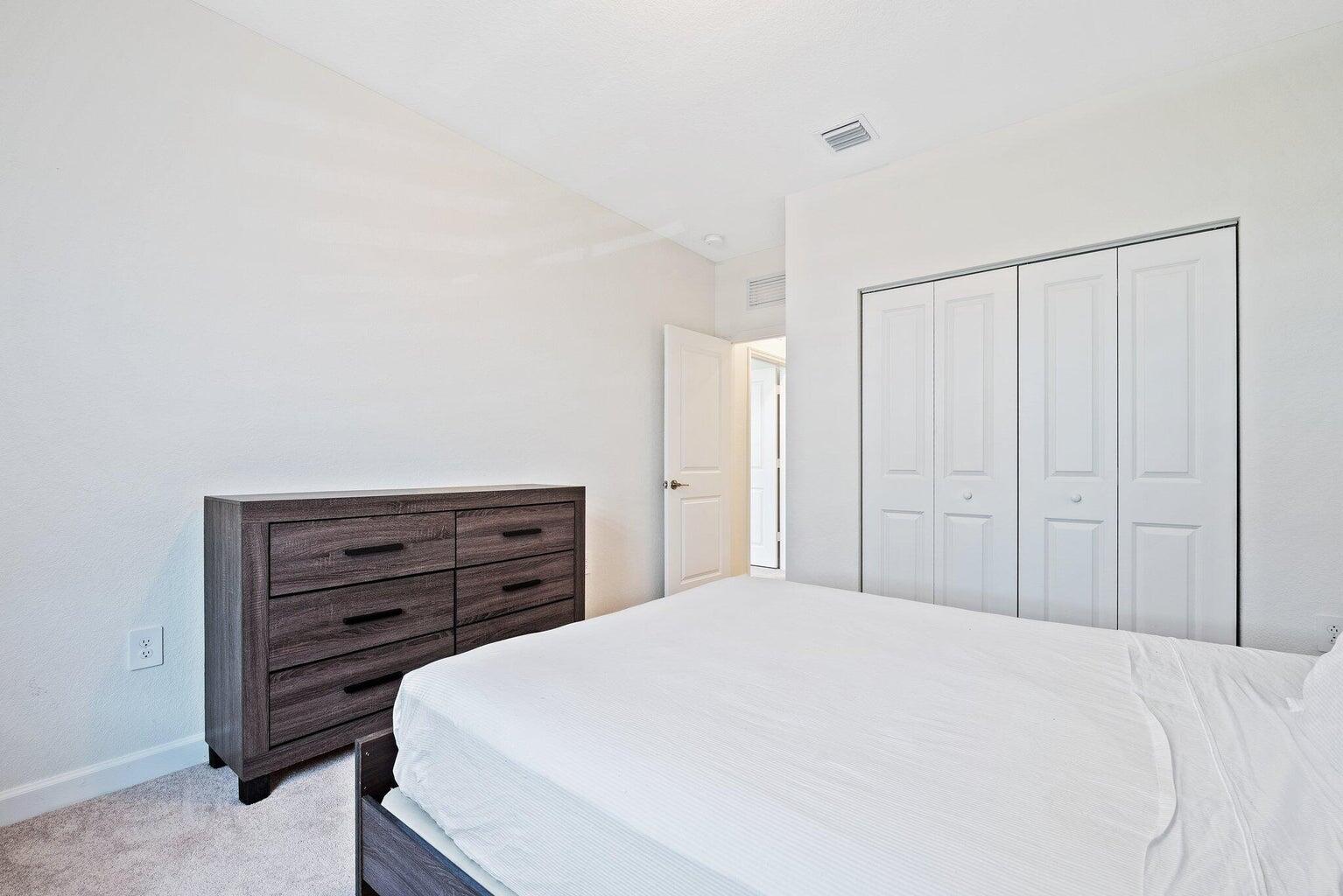 2701 Southeast 10th Street Homestead, FL 33035 - Photo 21 of 23 a bedroom with a bed and a dresser