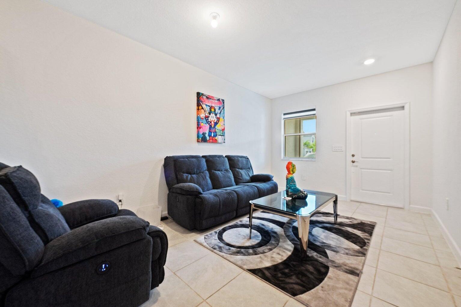 2701 Southeast 10th Street Homestead, FL 33035 - Photo 4 of 23 a living room with furniture and a wooden floor