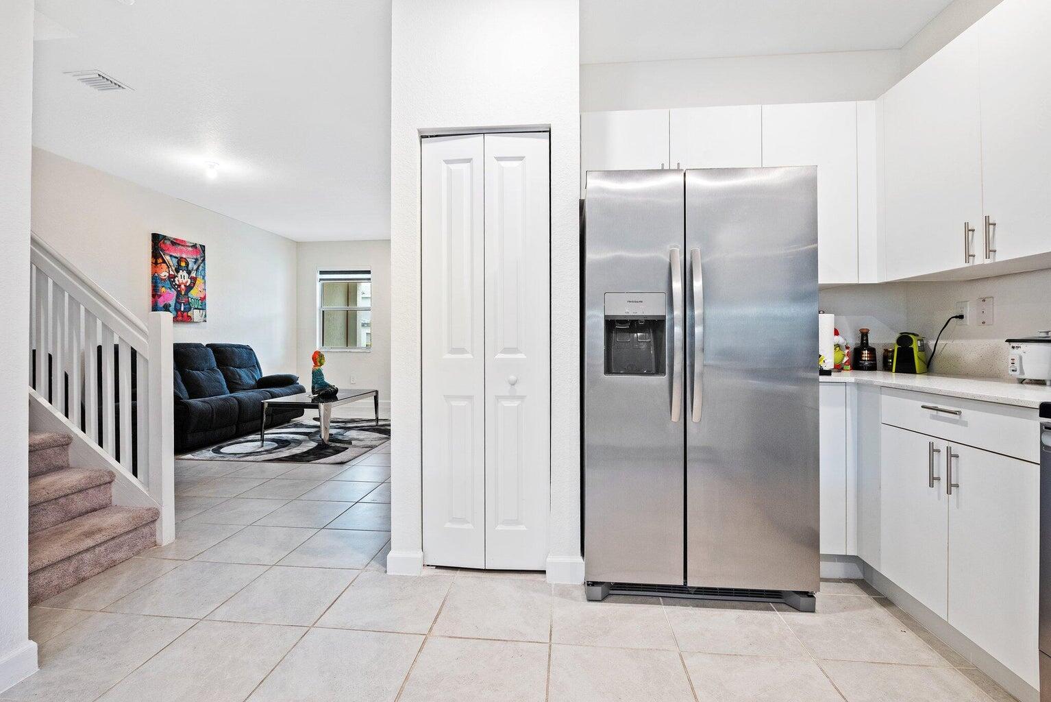 2701 Southeast 10th Street Homestead, FL 33035 - Photo 6 of 23 a kitchen with stainless steel appliances a refrigerator and a sink