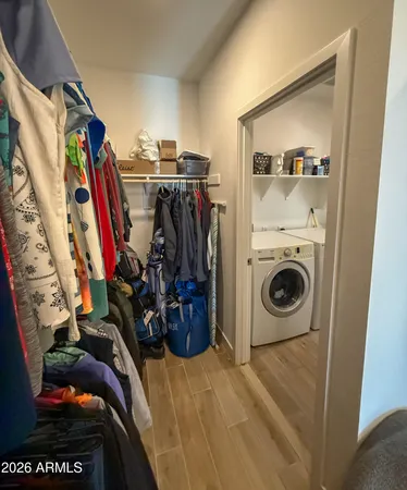 a view of a storage and utility room with a washer and dryer