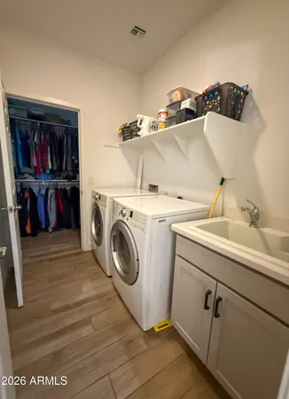 a utility room with dryer and washer