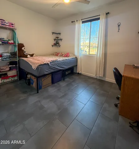 a bedroom with a bed and window