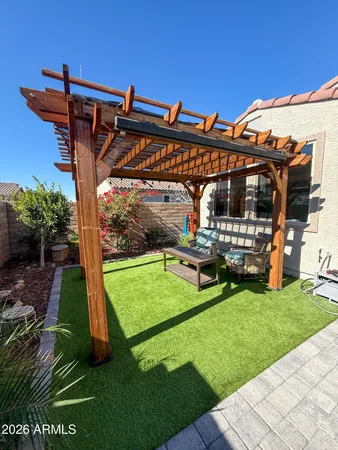 a view of a backyard with sitting area