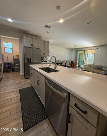 a kitchen with a sink and refrigerator