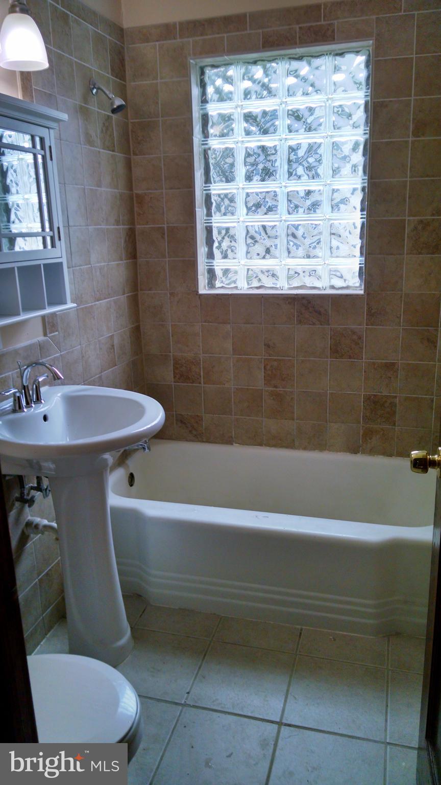 311 West W Delanco, NJ 08075 - Photo 11 of 13 a bathroom with a sink toilet and shower