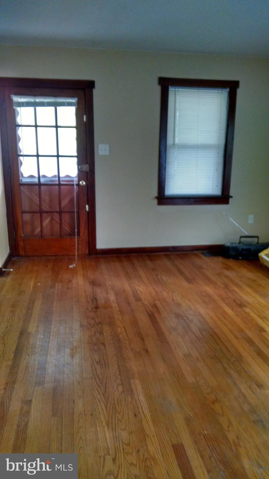 311 West W Delanco, NJ 08075 - Photo 12 of 13 an empty room with wooden floor and windows