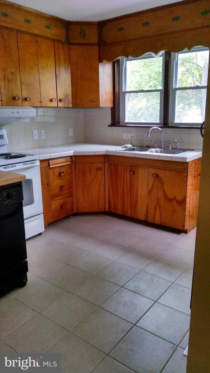 311 West W Delanco, NJ 08075 - Photo 13 of 13 a kitchen with granite countertop a stove a sink and a granite counter tops
