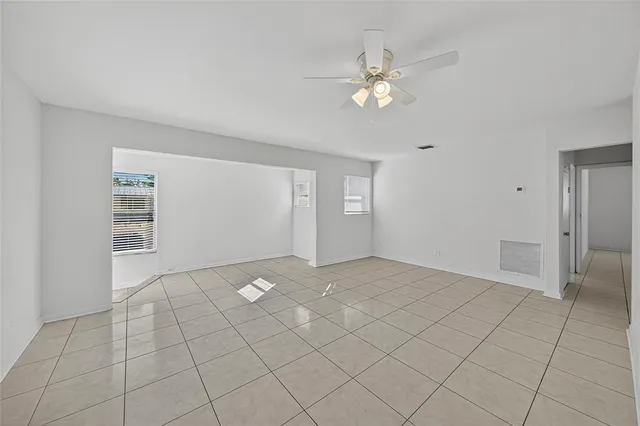 a view of an empty room with a window