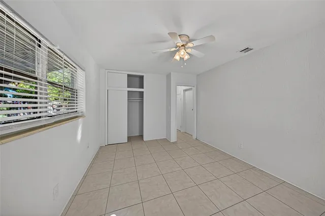 a view of an empty room with a window