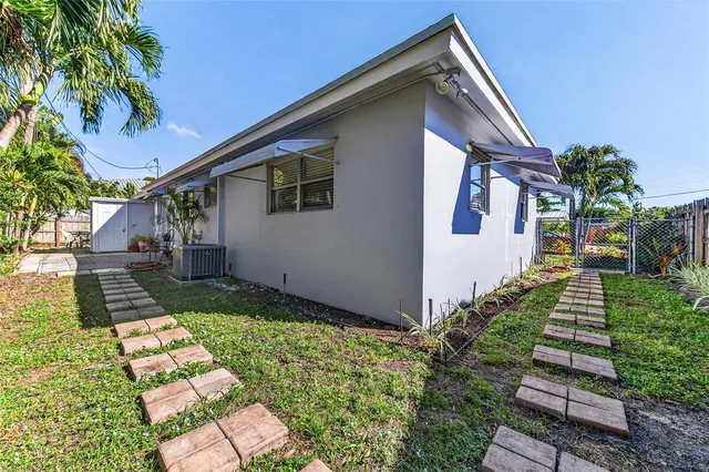a backyard of a house with lots of green space