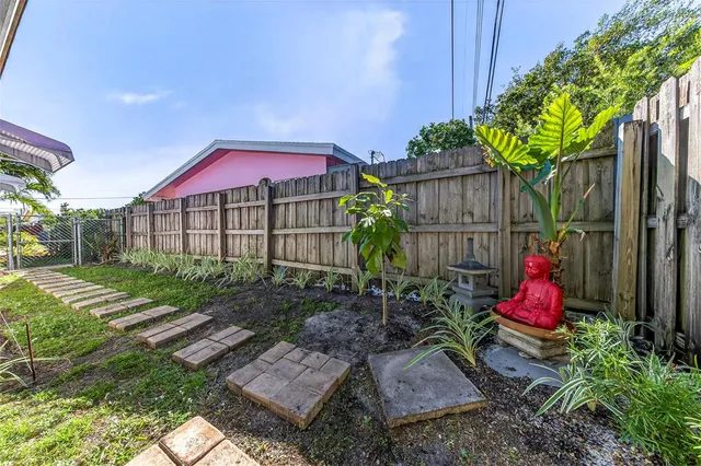 a view of yard with patio