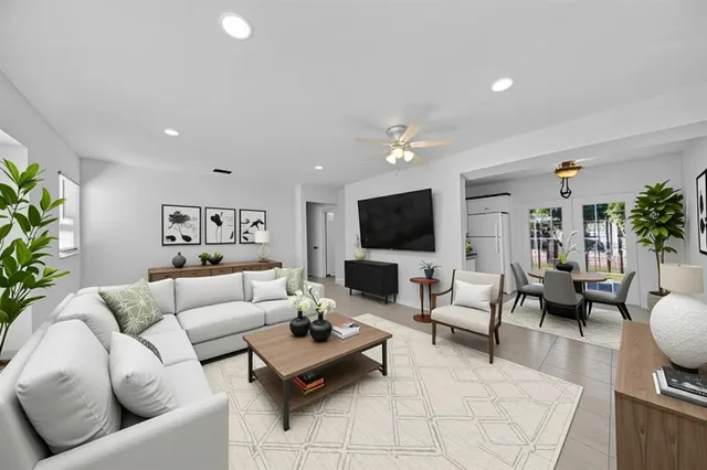 a living room with furniture and a flat screen tv