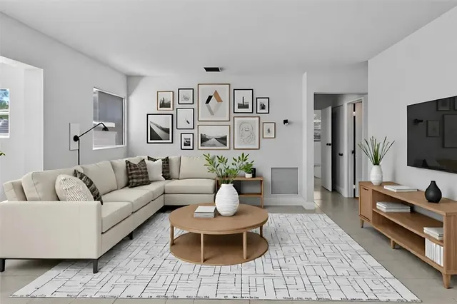 a living room with furniture and a flat screen tv