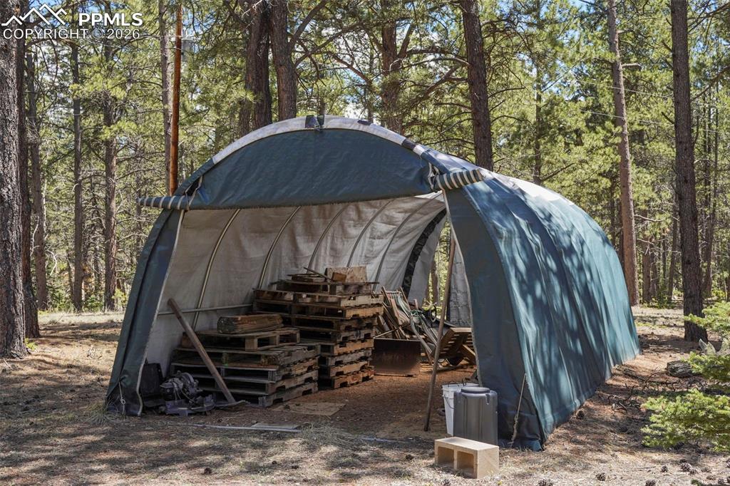 2450 Pathfinder Road Florissant, CO 80816 - Photo 20 of 29 a view of a house with a yard