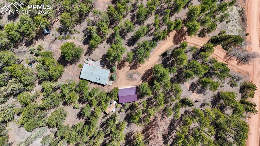 2450 Pathfinder Road Florissant, CO 80816 - Photo 26 of 29 an aerial view of a house with a yard and outdoor space