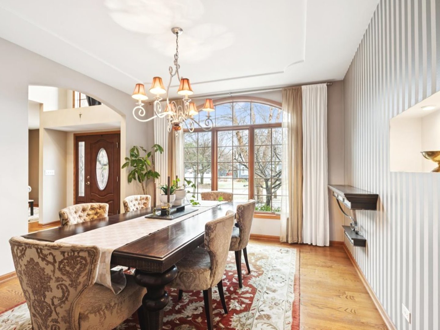 543 Chestnut Street Addison, IL 60101 - Photo 12 of 22 a view of a dining room with furniture wooden floor and a chandelier