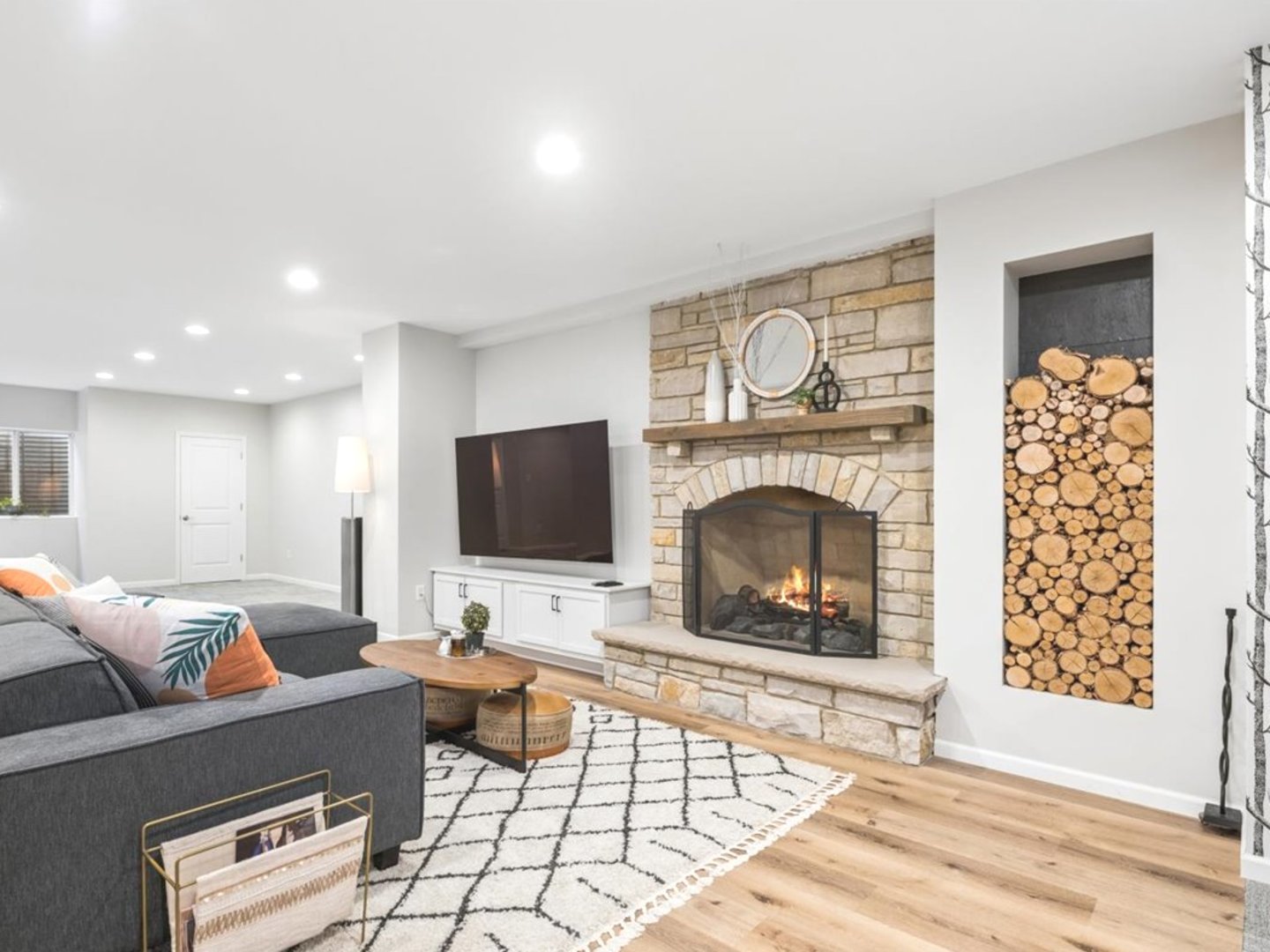 543 Chestnut Street Addison, IL 60101 - Photo 19 of 22 a living room with furniture a fireplace and a flat screen tv
