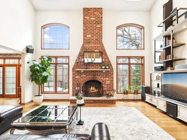 a living room with furniture fireplace and flat screen tv