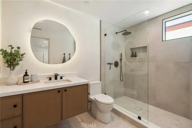 a room with a desk and mirror