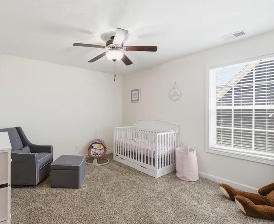 a bedroom with furniture and windows