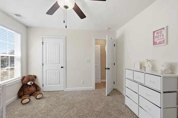 a view of room with furniture and a window