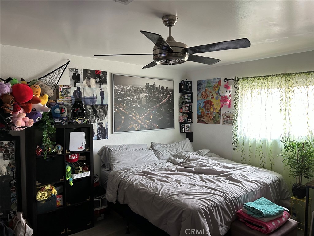10205 Bryson Avenue South Gate, CA 90280 - Photo 12 of 35 a bedroom with a bed and a window