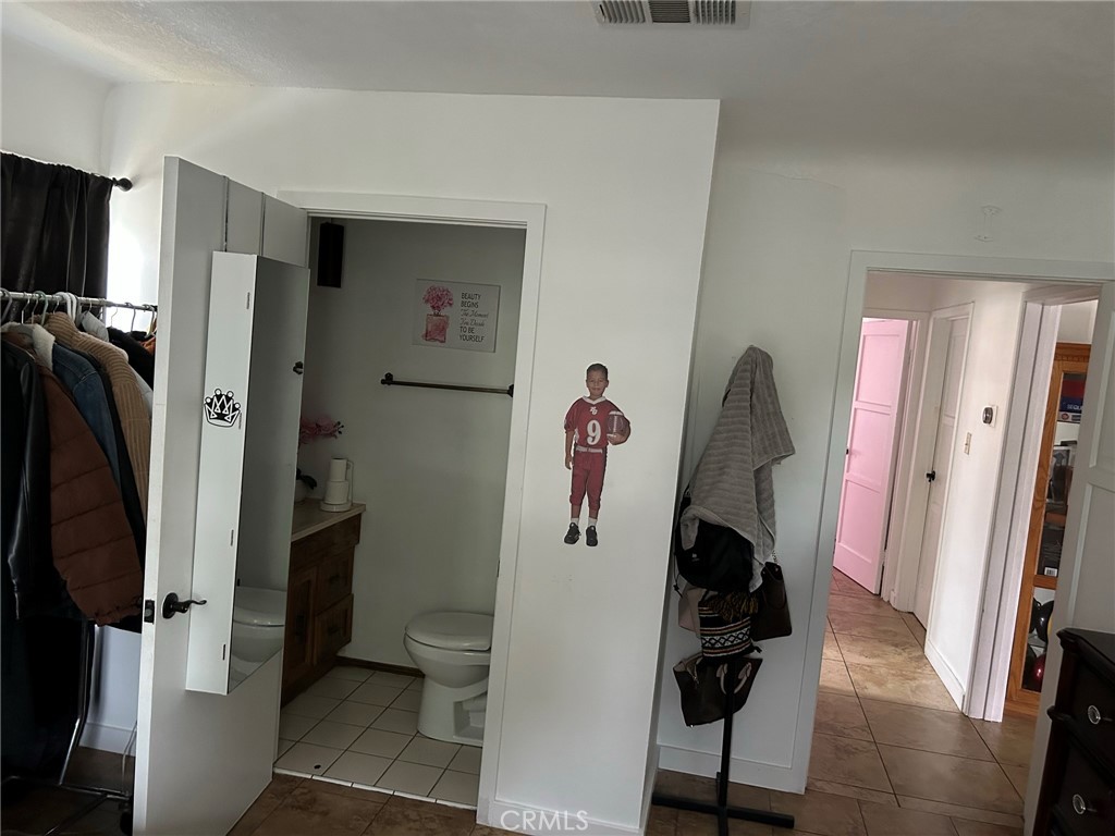 10205 Bryson Avenue South Gate, CA 90280 - Photo 15 of 35 a view of walk in closet with clothes and shoes