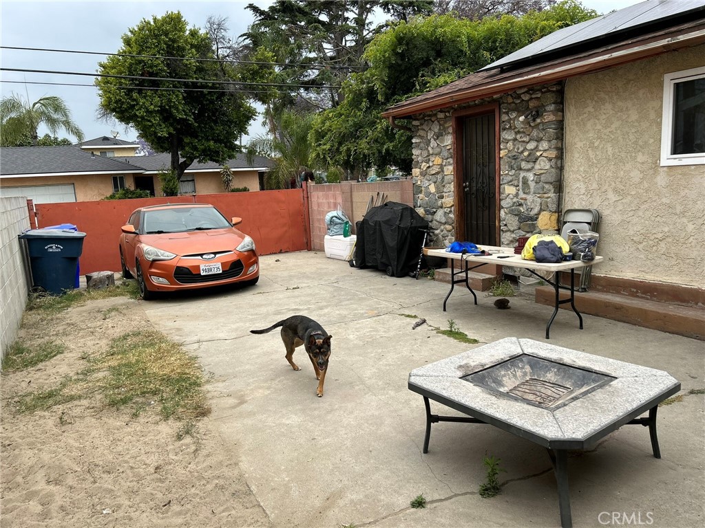 10205 Bryson Avenue South Gate, CA 90280 - Photo 32 of 35 a backyard of a house with barbeque oven table and chairs