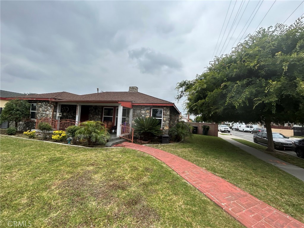 10205 Bryson Avenue South Gate, CA 90280 - Photo 6 of 35 a view of a house with a yard patio and sitting area