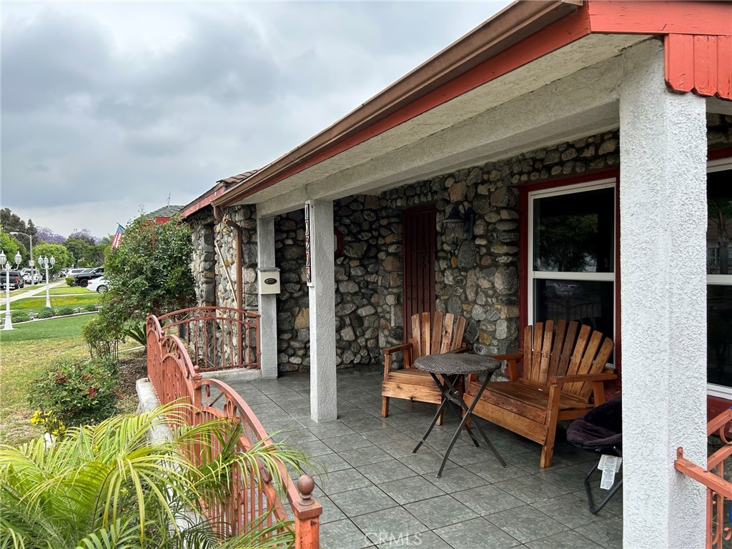 10205 Bryson Avenue South Gate, CA 90280 - Photo 8 of 35 a bench sitting in front of a house