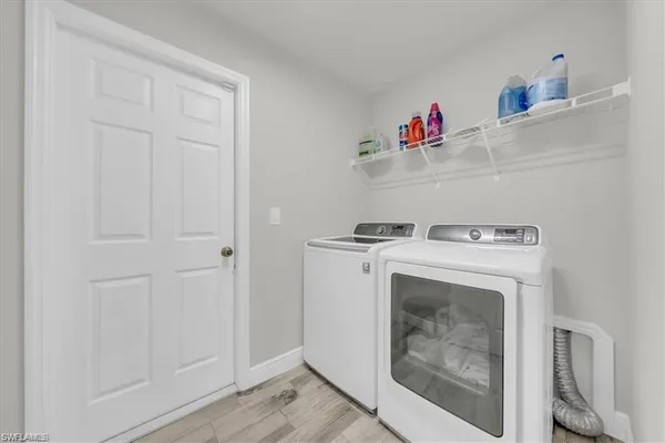 a bathroom with a granite countertop sink a large mirror and a shower