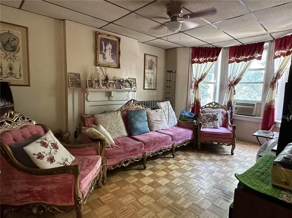627 50th Street Brooklyn, NY 11220 - Photo 6 of 9 a living room with furniture and a fireplace