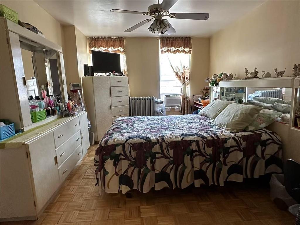 627 50th Street Brooklyn, NY 11220 - Photo 7 of 9 a bedroom with a bed and a mirror on the dresser