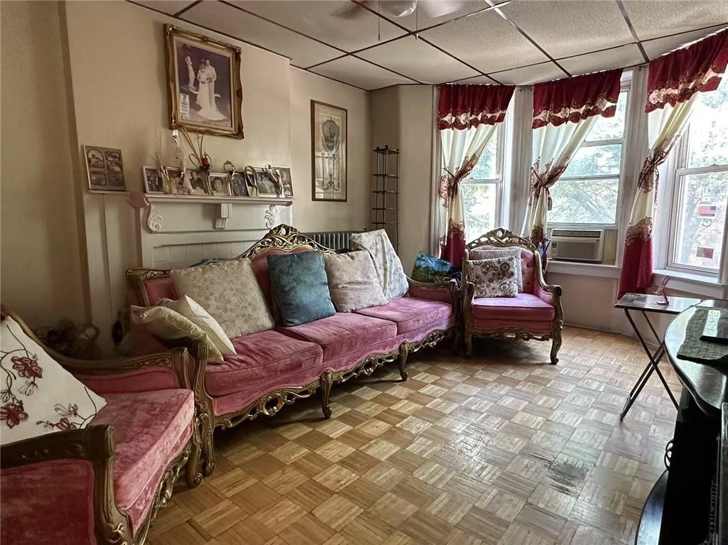 627 50th Street Brooklyn, NY 11220 - Photo 8 of 9 a living room with furniture and a large window