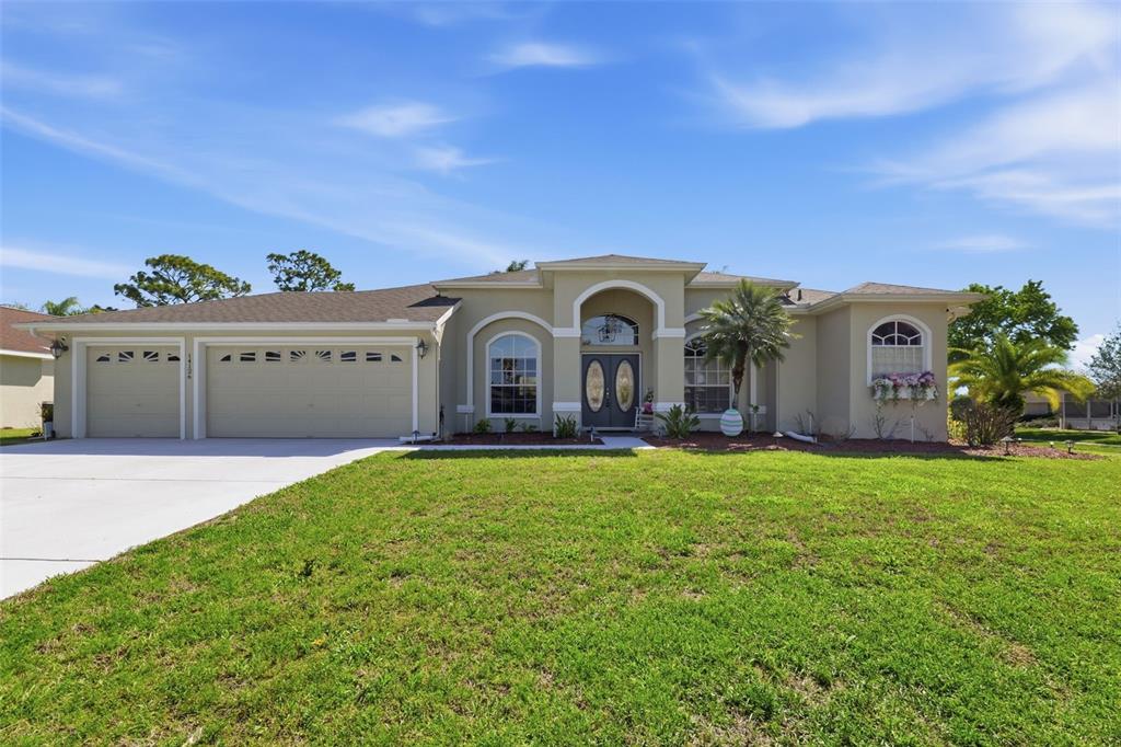 14126 Andrew Scott Road Spring Hill, FL 34609 - Photo 1 of 29 a view of a front of house with yard and garage