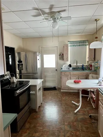 a kitchen with a sink and stove