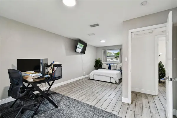 a bedroom with furniture and a window