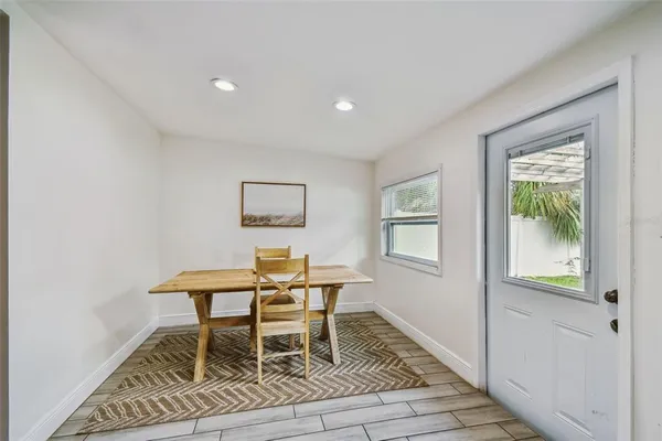 a work room with furniture and a window