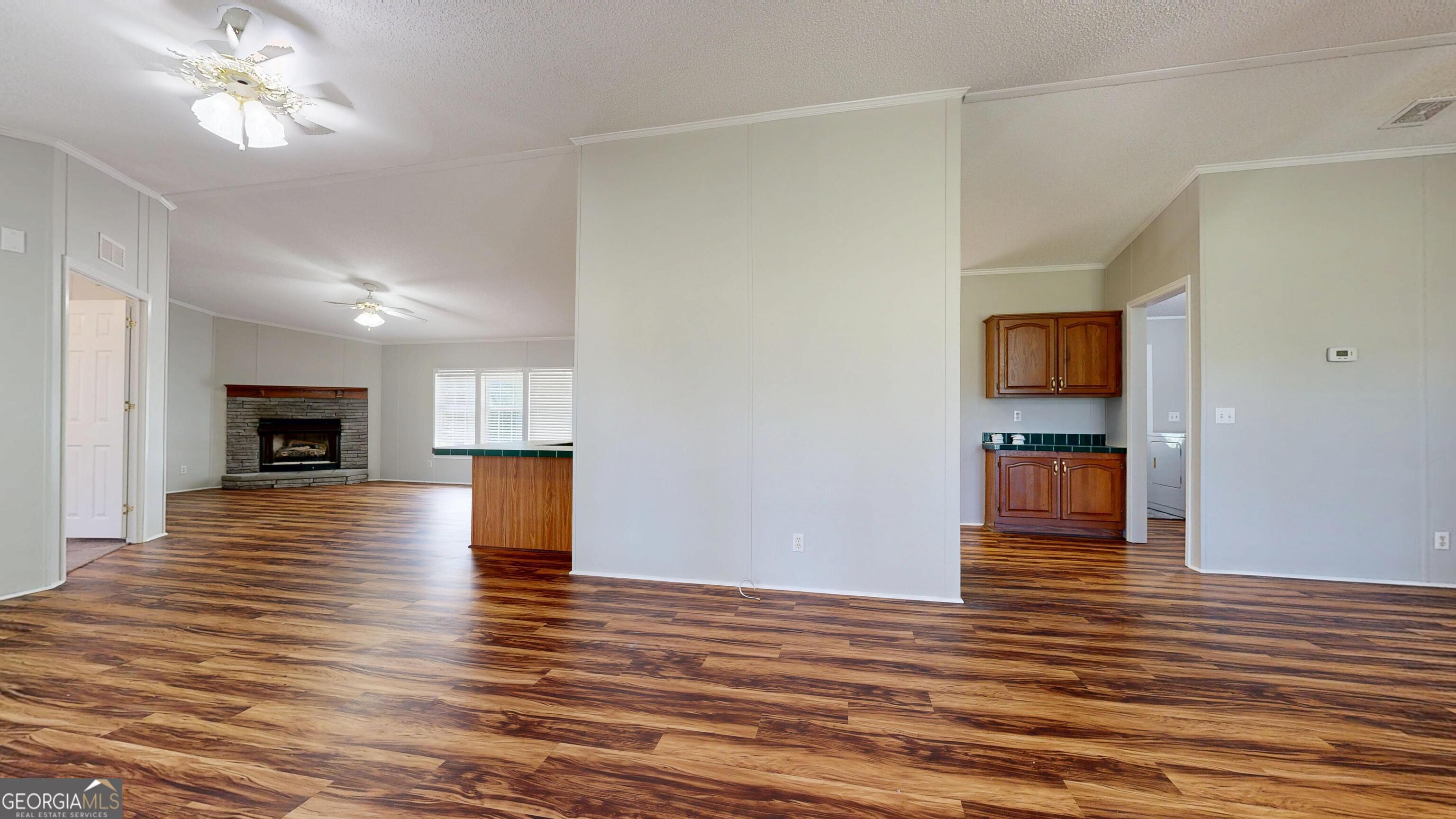 6498 Central Avenue Waycross, GA 31503 - Photo 5 of 20 a view of a livingroom with wooden floor